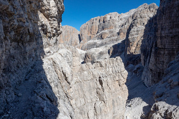 Wall Mural - Fixed-rope Route, climbing a via ferrata route. Italian Alps. Mountain tourism in the Dolomites. Region Brenta, Italy.