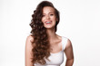 Beautiful young girl in white dress with natural make-up, hair curls and smile.