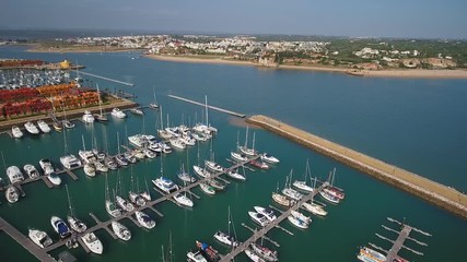 Canvas Print - Aerial. Aerial view of a Portuguese marina with yachts and motor boats, the city of Portimao.