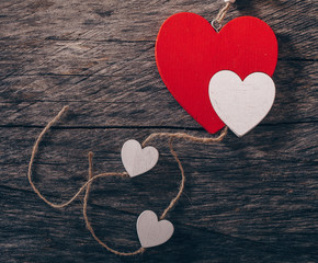 red heart on wooden background