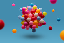 Colorful Balls Levitation In Mid Air On Blue Background