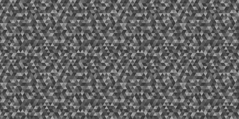 Tiled pattern from triangles. Seamless abstract texture. Triangle background. Doodle for banner. Black and white illustration