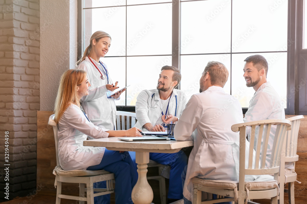 Doctors at meeting in modern clinic