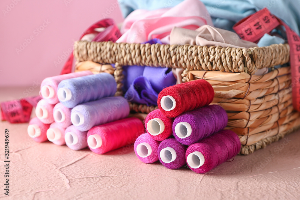 Set of tailor's supplies on color background