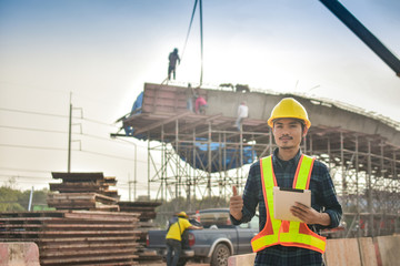 Foreman holding tablet use technology inspection control construction architecture site