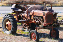 A Rusted Red Old Farm Tractor