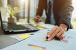 © A Stockphoto - Businesspeople partners discussing documents and ideas at discussing together in conference room during meeting at office .