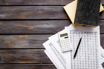Wall Mural - Financial literature. Books near documents, calculator on dark wooden background top-down copy space