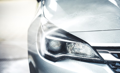 manual wash for perfect clean car. cleaning car using high pressure water. close up concept.