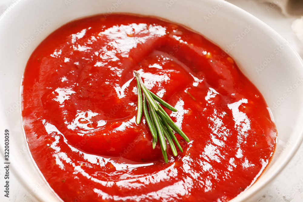 Bowl with tomato sauce, closeup