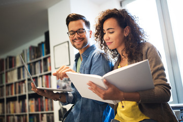 Students are studying together in library. Couple, study, technology, education love concept