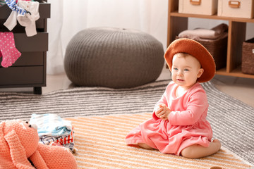 Sticker - Cute baby with stylish hat at home