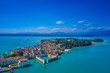© Berg - Unique view. Aerial photography, the city of Sirmione on Lake Garda north of Italy. In the background is the Alps. Resort place. Aerial view. Sirmione Castle,