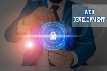 Writing note showing Web Development. Business concept for dealing with developing websites for hosting via intranet