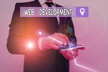 Writing note showing Web Development. Business concept for dealing with developing websites for hosting via intranet