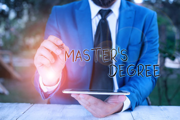 Wall Mural - Conceptual hand writing showing Master S Degree. Concept meaning degree that is given to a student by a college or university Businessman pointing with pen in empty copy space