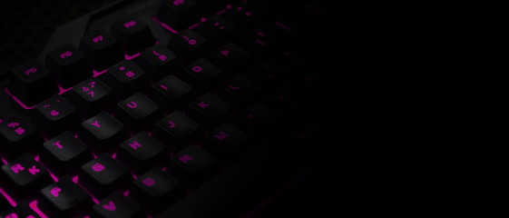 Backlit gaming keyboard close up.