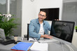 © W PRODUCTION - handsome young happy businessman casual wear at office business desk showing screen