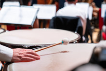 The Hands Of A Musician Playing On A Timpani