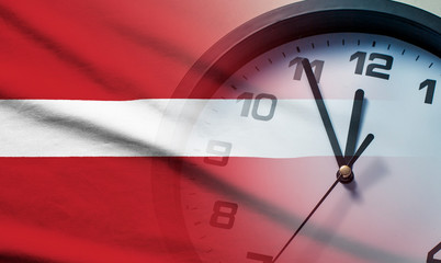Wall Mural - composite image of the latvia flag and clock