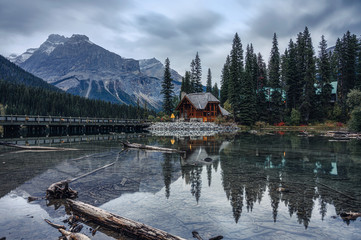 Wooden house with rocky mountain in pine forest at Emerald lake