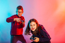 Emotional Girl And Boy Playing Virtual Game