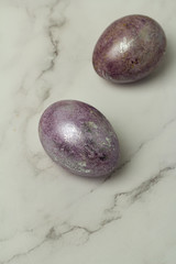 Wall Mural - lilac eggs on a white background