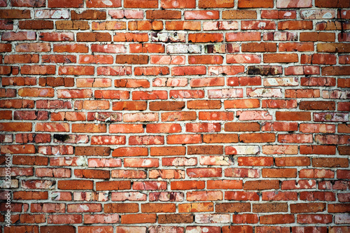 Weathered texture of dark brown and red brick wall background Canvas Print