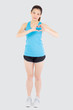 © NT_studio - Beautiful young asian woman in sport with healthy gesture heart shape with hand isolated on white background, asia girl showing heart symbol, exercise with cardio for health and wellbeing concept.