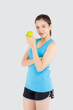 © NT_studio - Beautiful portrait young asian woman in sport clothing with satisfied and holding green apple isolated on white background, girl asia have shape and wellness, exercise for fit with health concept.