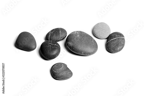 Fotografía Stones isolated on white background, sea pebbles