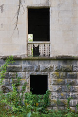 Two black holes in the stone wall of the building