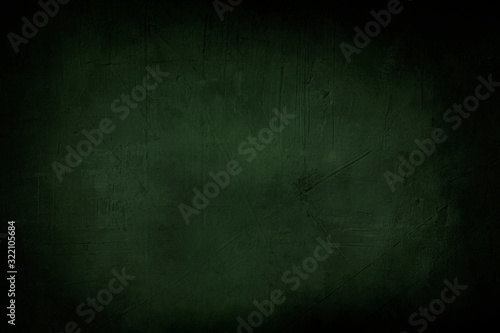 Fotografía dark green grunge background or texture with black vignette borders