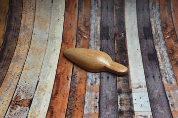 Wall Mural - A small brown spoon made of wood