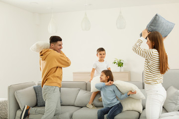 Sticker - Happy family having pillow fight in living room