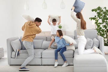 Sticker - Happy family having pillow fight in living room