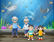 An elderly couple and their grandchildren looking at fishes