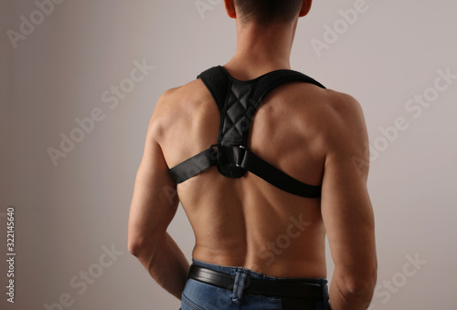 Fotografía Attractive muscular man with posture corrector