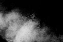 Isolated White Fog On The Black Background, Smoky Effect For Photos And Artworks. Smoke And Powder Overlay On Black Background