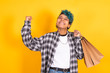 © carballo - isolated young girl or woman with shopping bags smiling happy