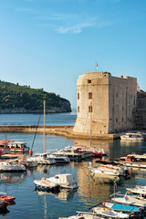 Sticker - St John Fortress and boats in Old port in Dubrovnik