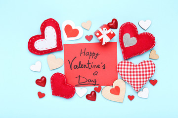 Wall Mural - Valentine hearts with gift box and text Happy Valentines Day on blue background