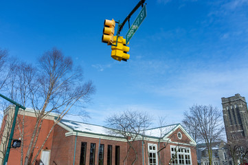 Poster - traffic lights against blue sky in winter in North America