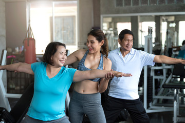 Group of friend asian senior stretching exercise at yoga gym.  elderly healthy lifestyle.