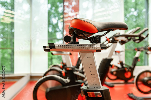 Stationary Spinning bicycles. Indoor cycling for lifestyle design. Fitness background. Healthy lifestyle background. Spinning class with empty bikes. Sport background. Sport, recreation, lifestyle