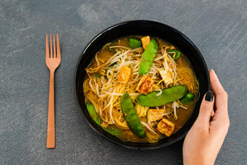 vegan laksa noodle soup with snowpeas and tofu