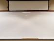 © Adventuring Dave - Blank glossy white board at front of classroom