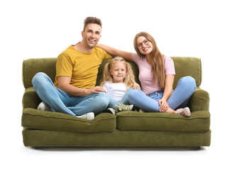 Happy young family sitting on sofa against white background