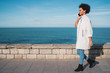 © Mego-studio - Latin woman talking on the phone.