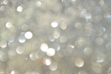 bokeh of bright glittering sheet with shining sunlight